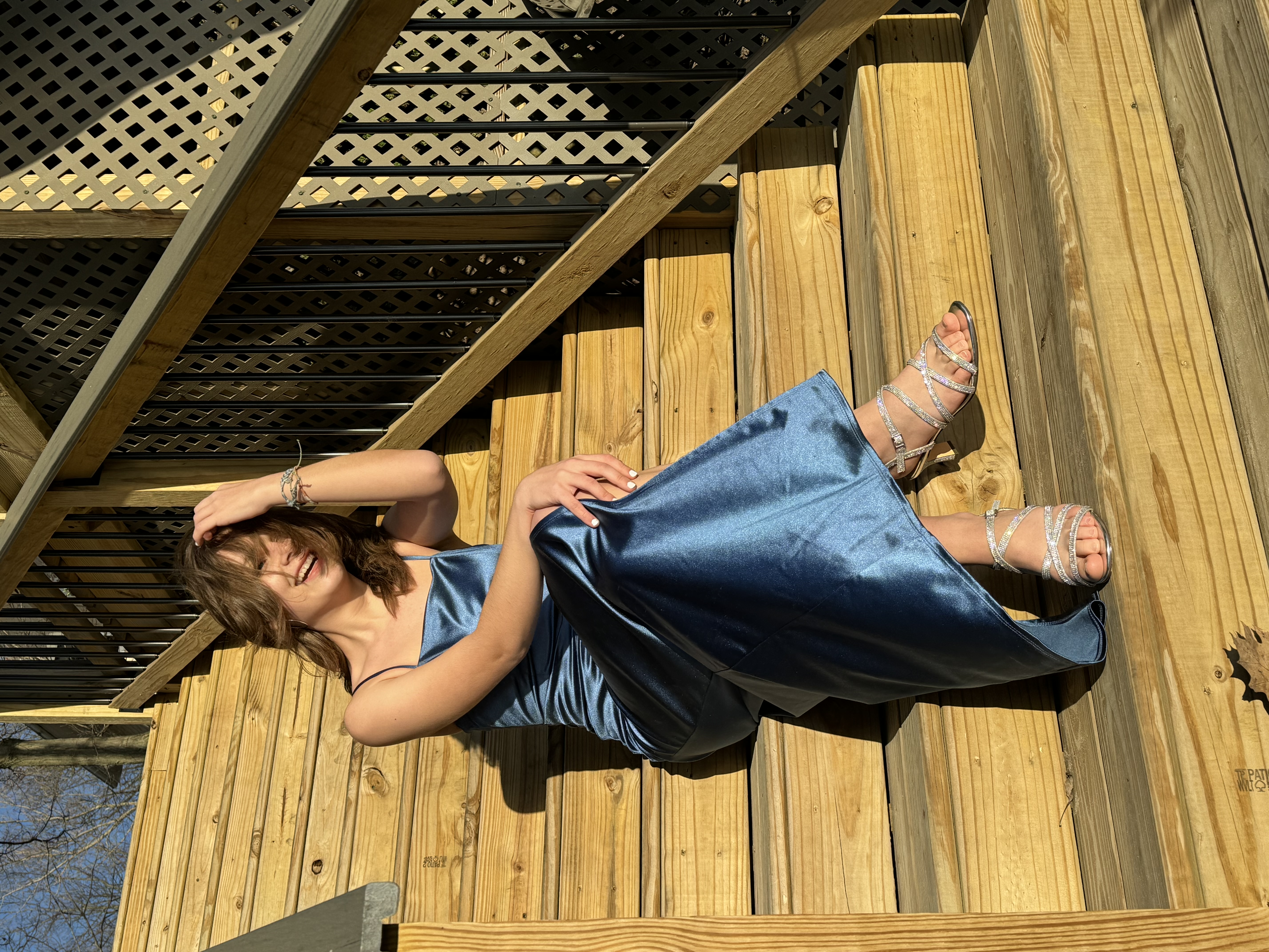 a girl posing with a dress on